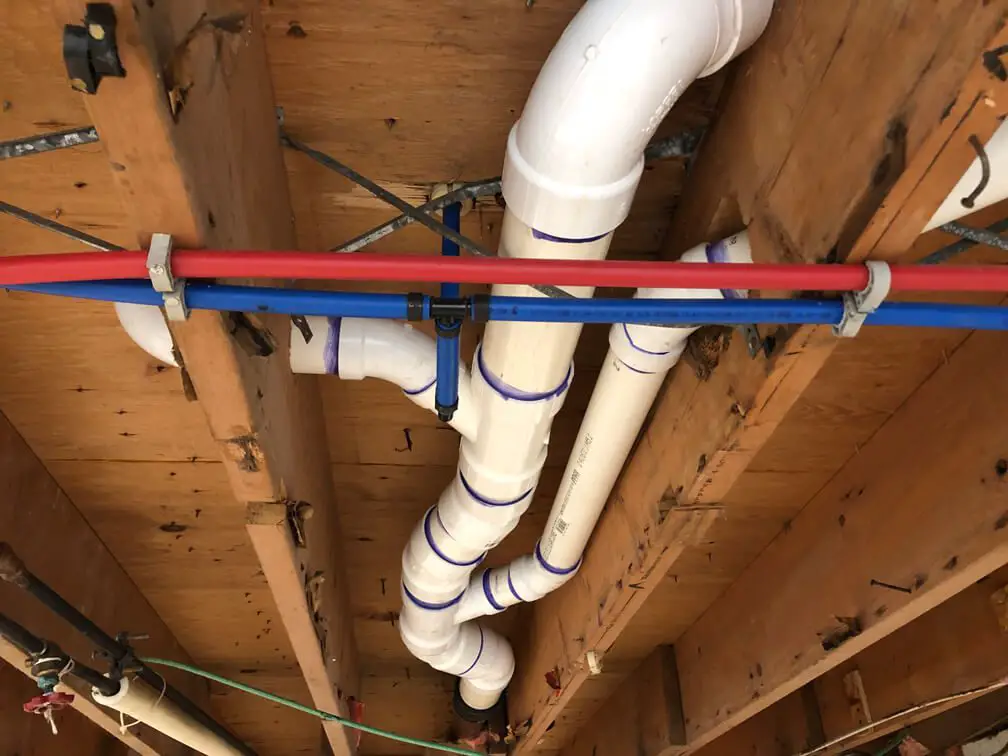 Begin by running the toilet drain pipe
