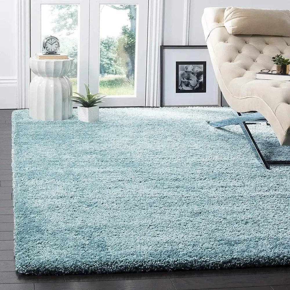 Use a lovely blue carpet to give the room a coastal feel