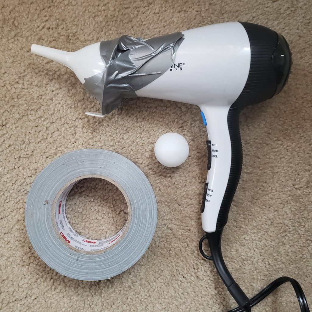 Heat a duct tape with a hair dryer: How To Fix a Cracked Mirror