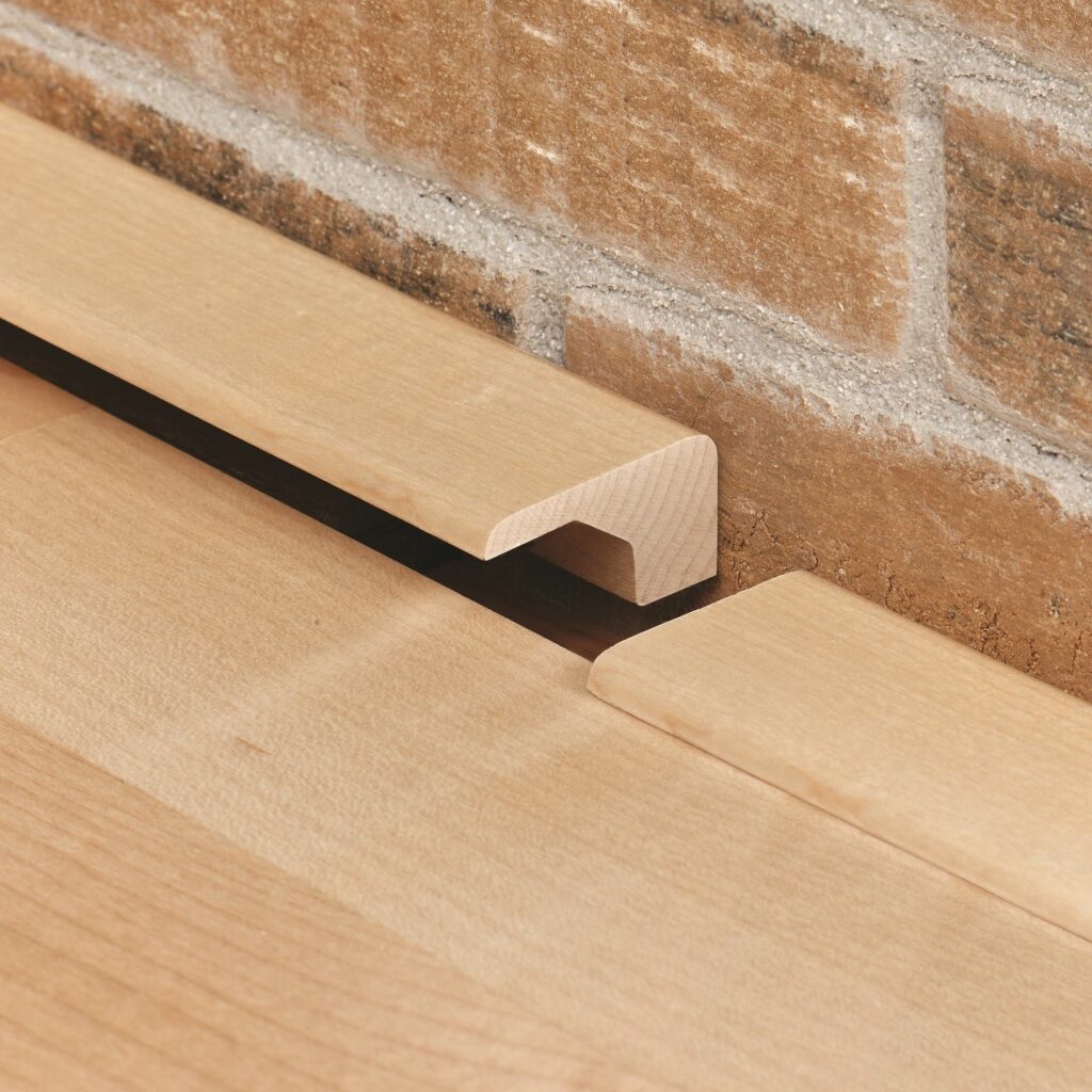 Use square or angle nose molding for Transitioning Wood Flooring Between Rooms